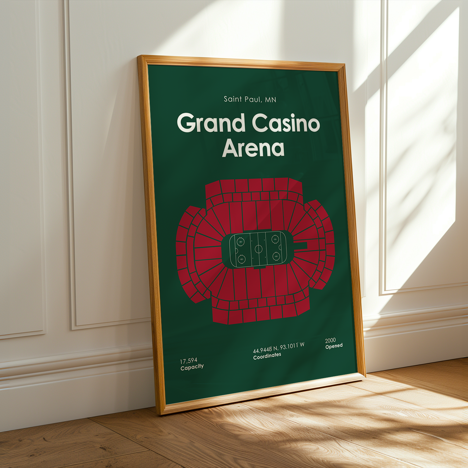 Framed poster of Grand Casino Arena with a green background and red seating layout.