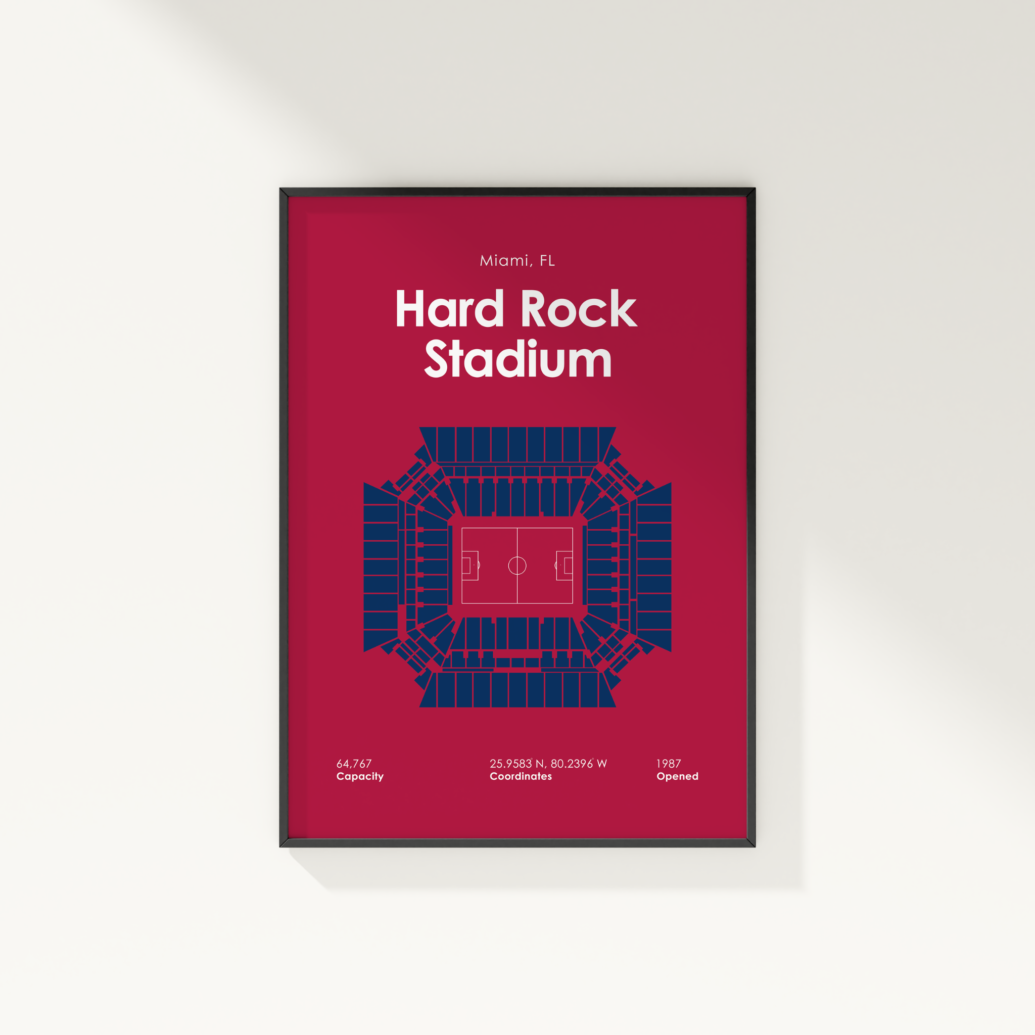 Framed poster of Hard Rock Stadium with blue seating layout on a red background