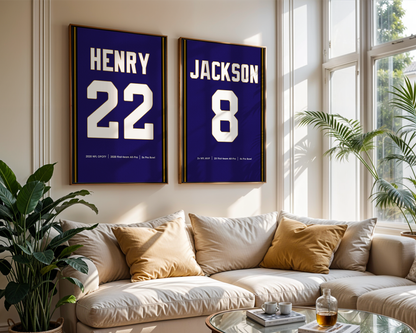 Two framed sports jerseys with names and numbers on a wall above a sofa in a living room.