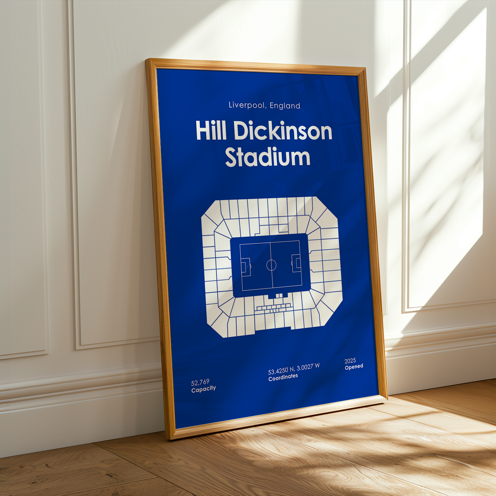 Framed poster of Hill Dickinson Stadium with blue background and wooden frame.