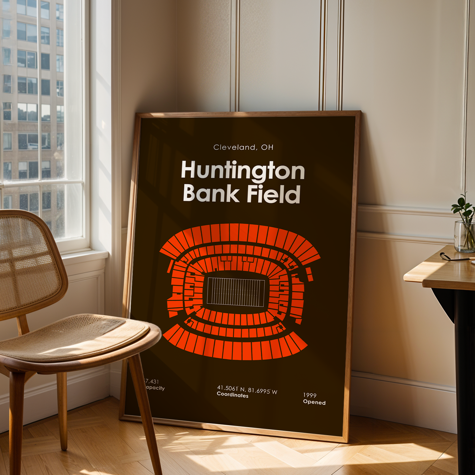 Poster of Huntington Bank Field in a room with a chair and table.