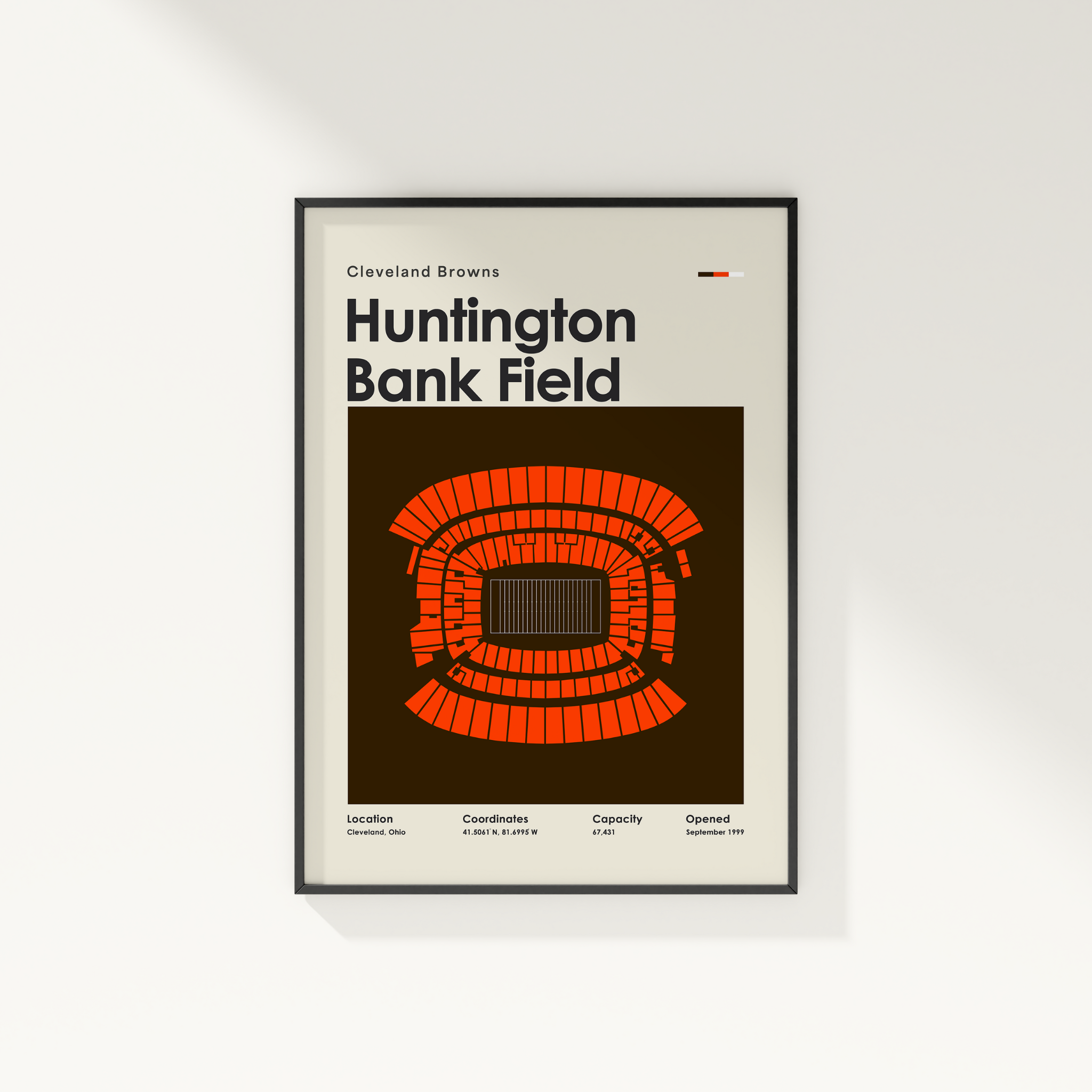 Framed poster of Huntington Bank Field with seating chart and text on a white wall.