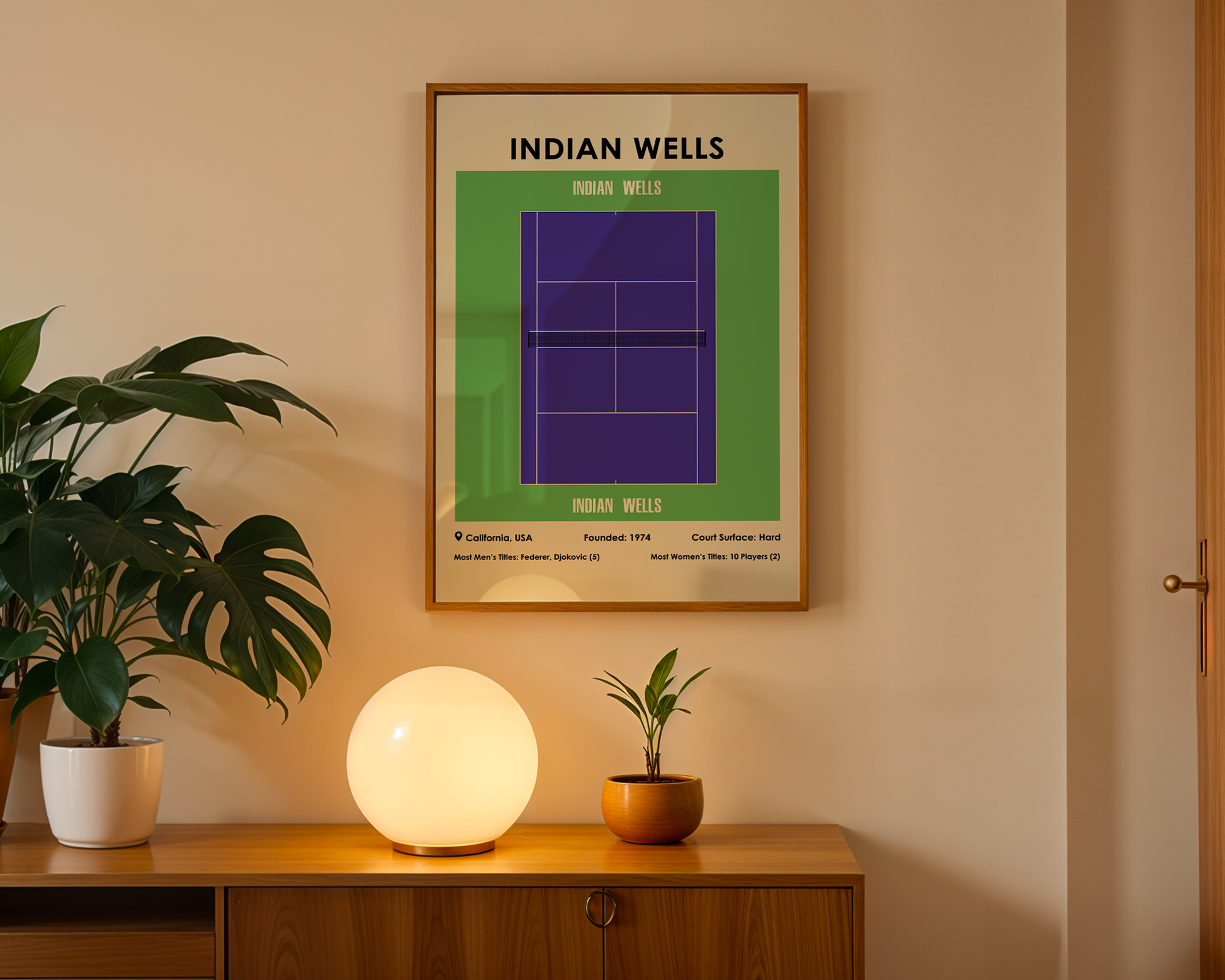 Framed poster of Indian Wells tennis tournament on a wall above a wooden cabinet with decorative items.
