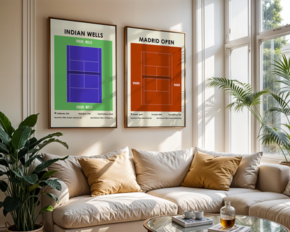 Living room with a beige sofa, decorative pillows, and framed tennis court posters on the wall.
