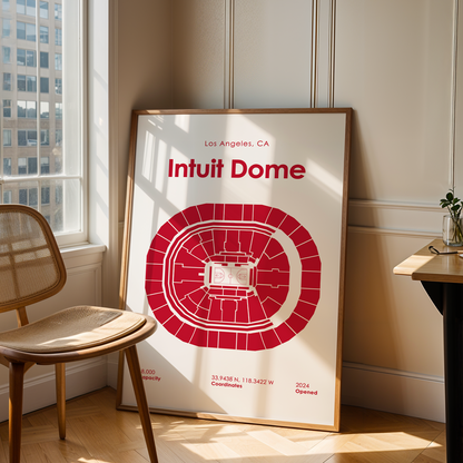 Poster of Intuit Dome in a room with a chair and table.