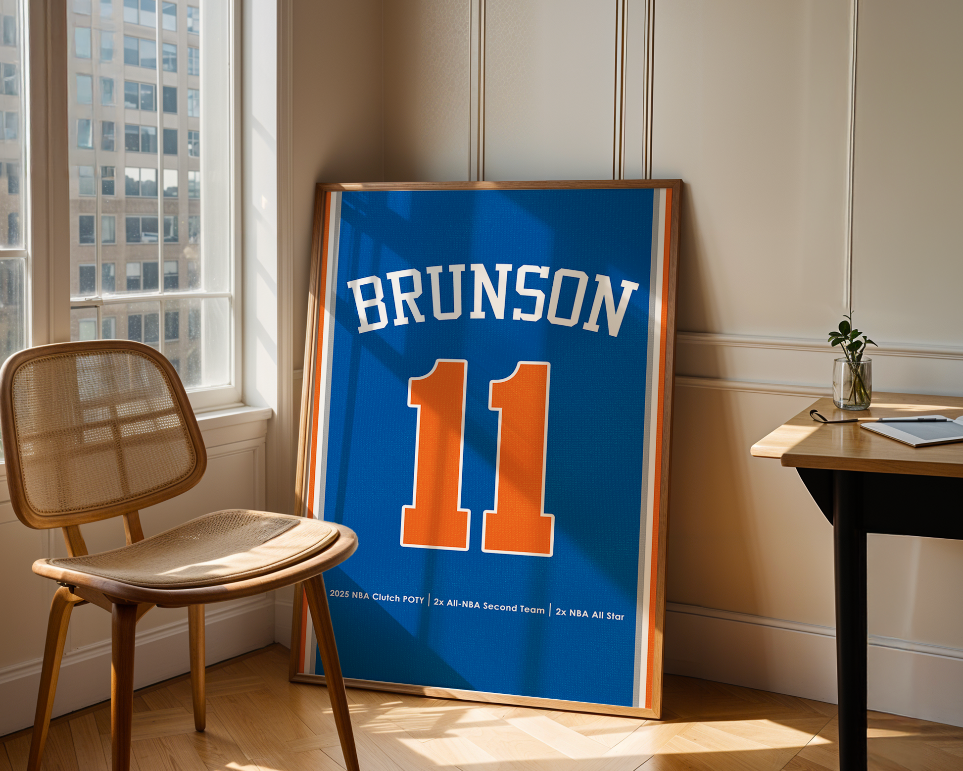 Framed sports jersey with 'Brunson' and number '11' in a room with a window and chair.