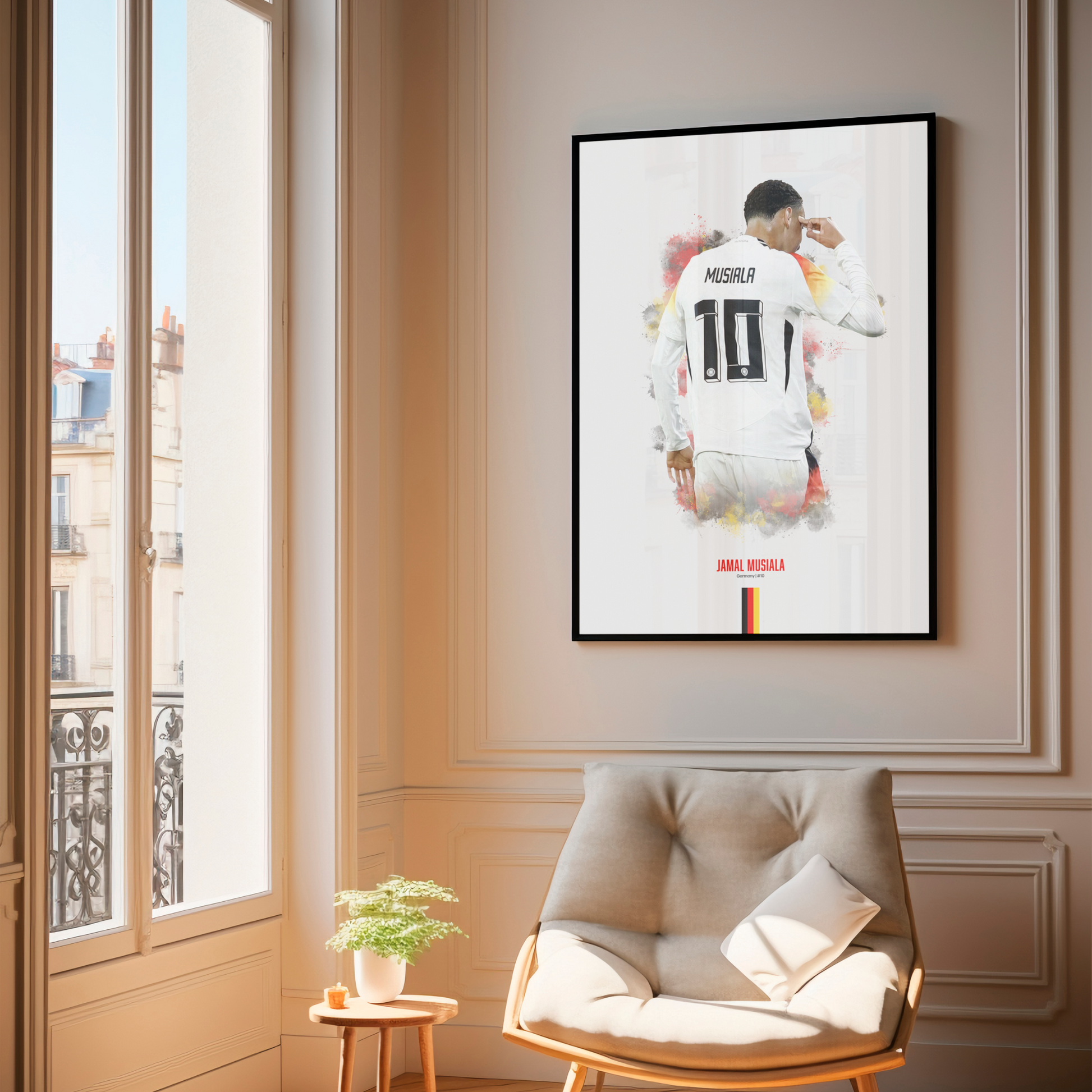 framed poster mockup of football player jamal musiala hanging in a living room