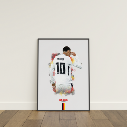 framed poster mockup of football player jamal musiala leaning on a white wall