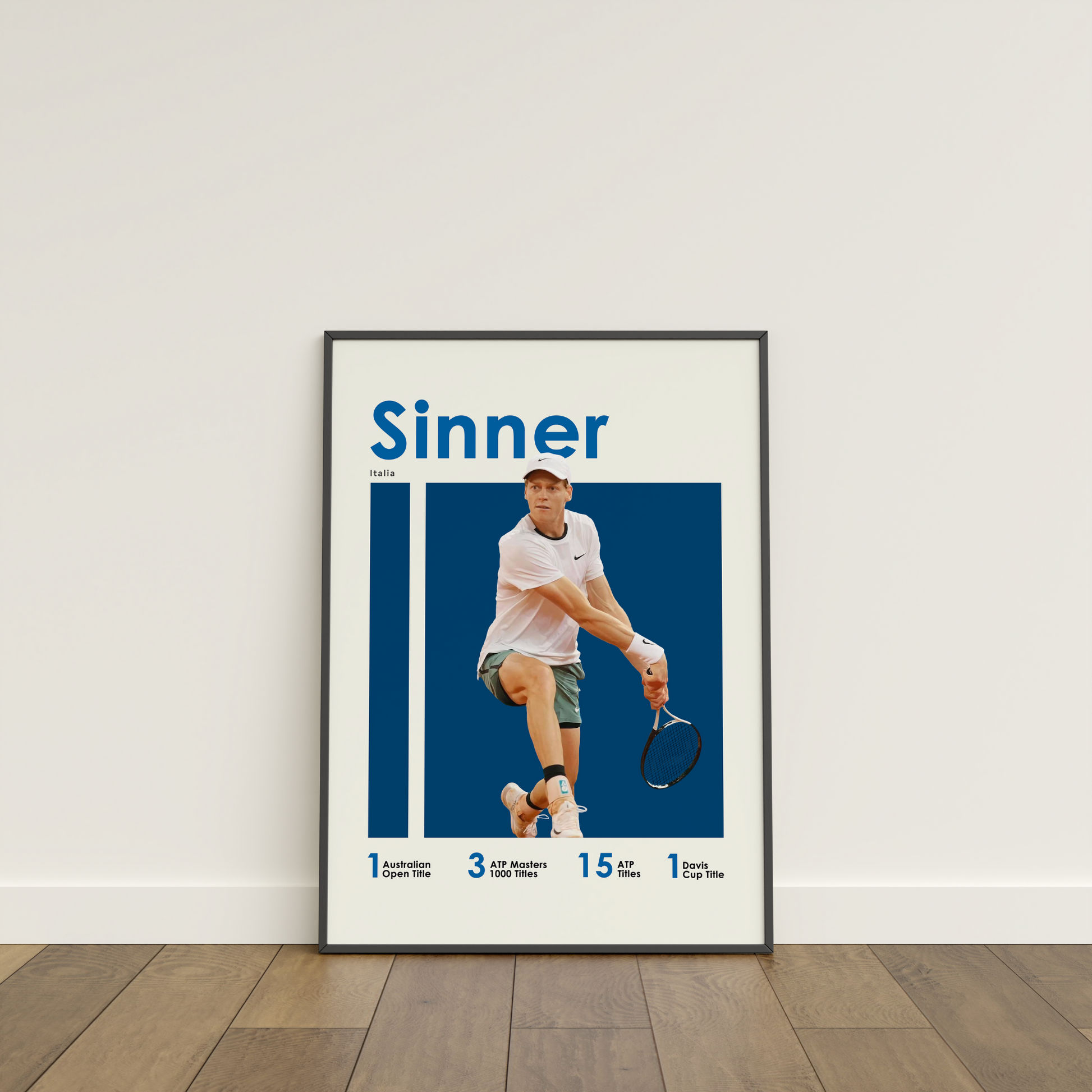 framed poster mockup of tennis player jannik sinner leaning on a white wall