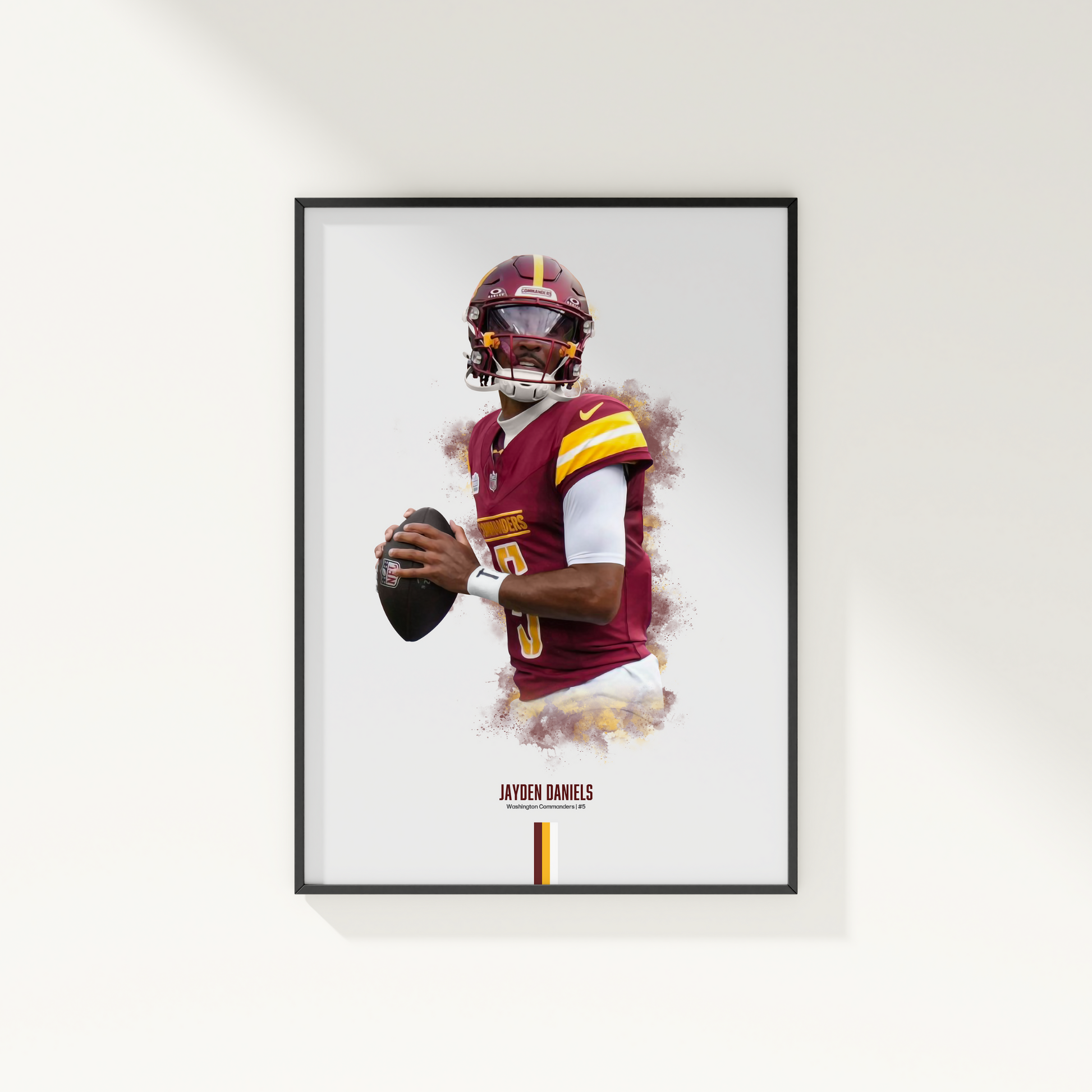 framed poster mockup of football player jayden daniels hanging on a white wall