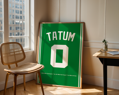 Framed sports jersey with 'Tatum' and number '0' in a room with a window and chair.