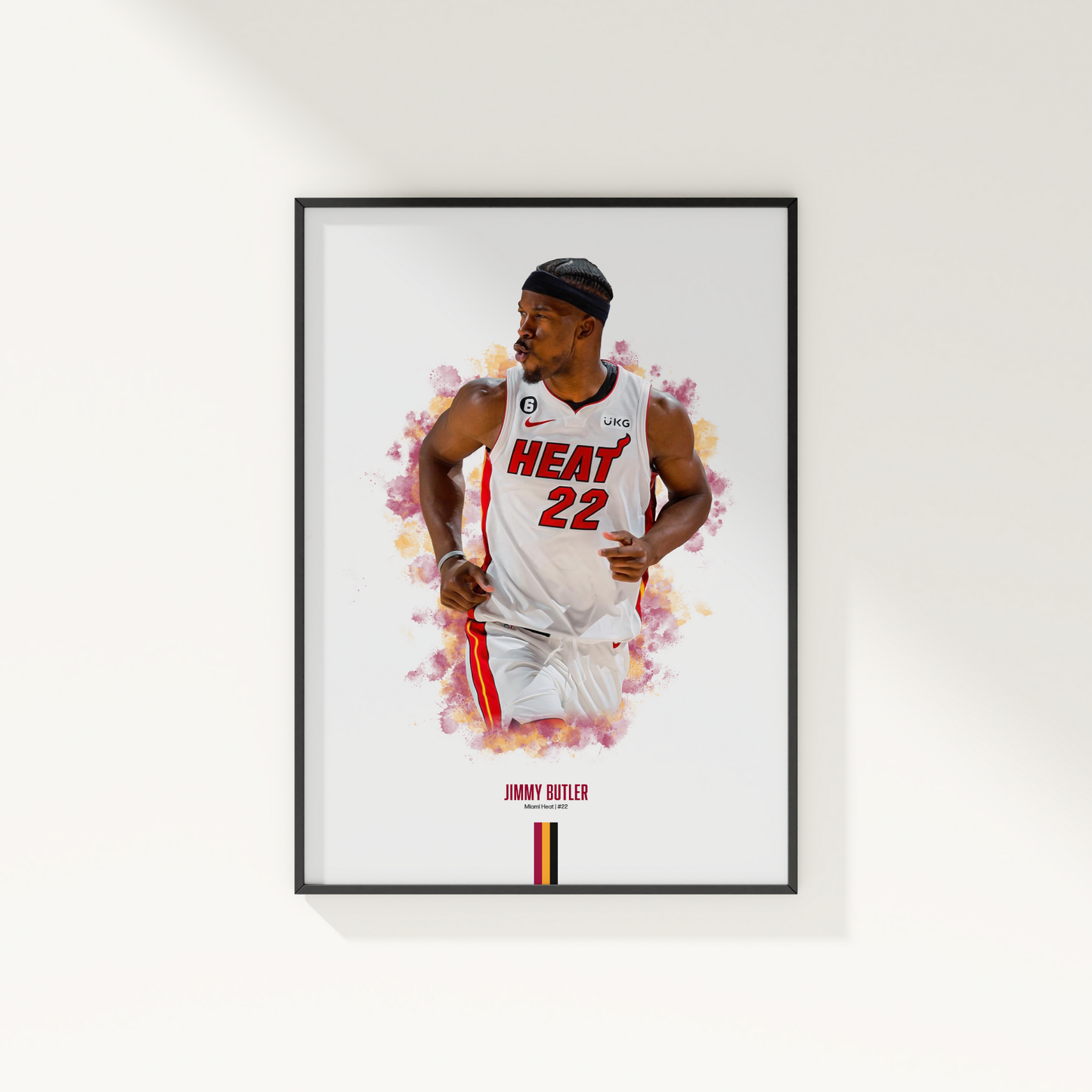 framed poster mockup of basketball player jimmy butler hanging on a white wall