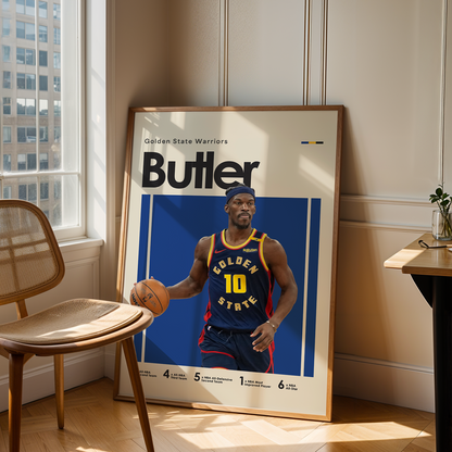 Framed sports poster of a basketball player in a room with a chair and table.