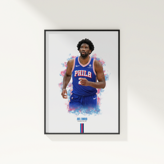 framed poster mockup of basketball player joel embiid hanging on a white wall