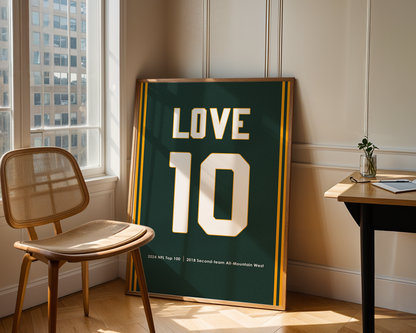 Framed jersey with 'LOVE 10' in a room with a window and chair.