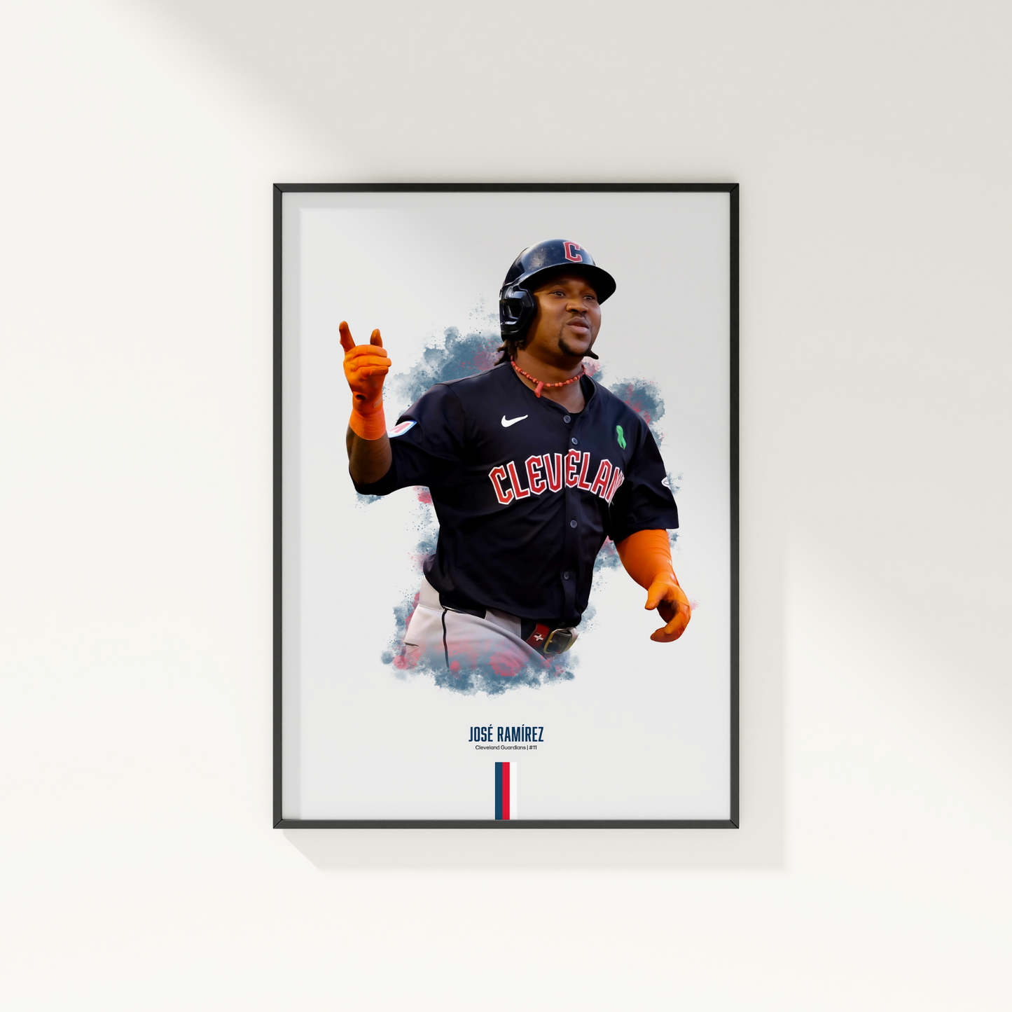 framed poster mockup of baseball player jose ramirez hanging on a white wall