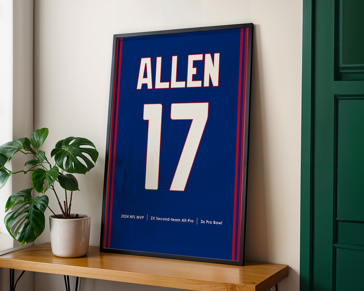 Framed sports jersey with 'Allen' and number '17' on a wooden shelf.