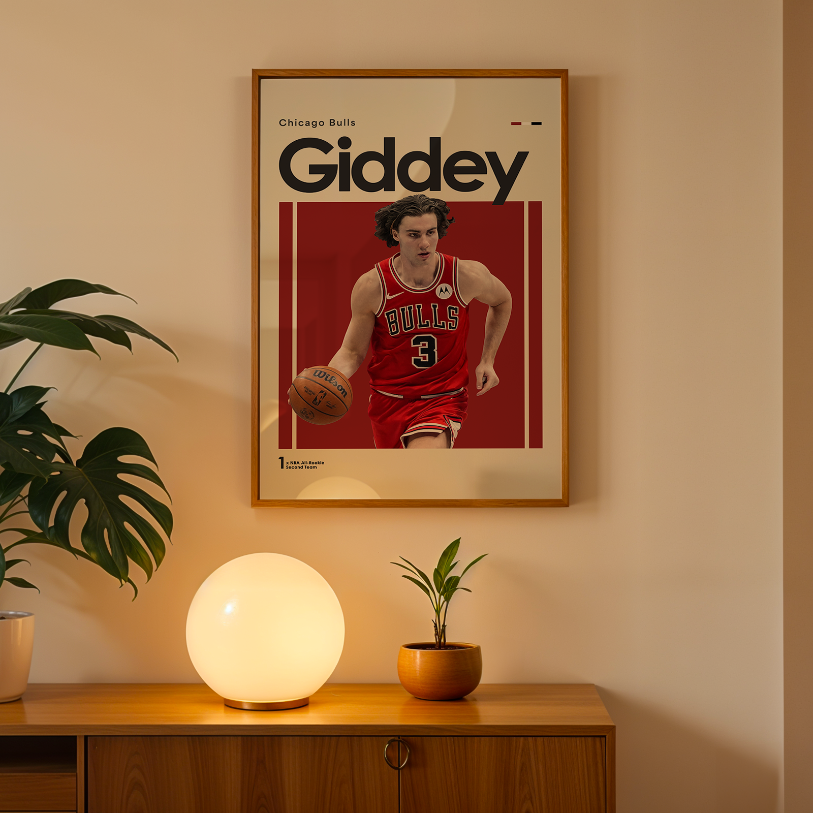 Framed poster of a basketball player with 'Giddey' on a wall above a wooden cabinet with decorative items.