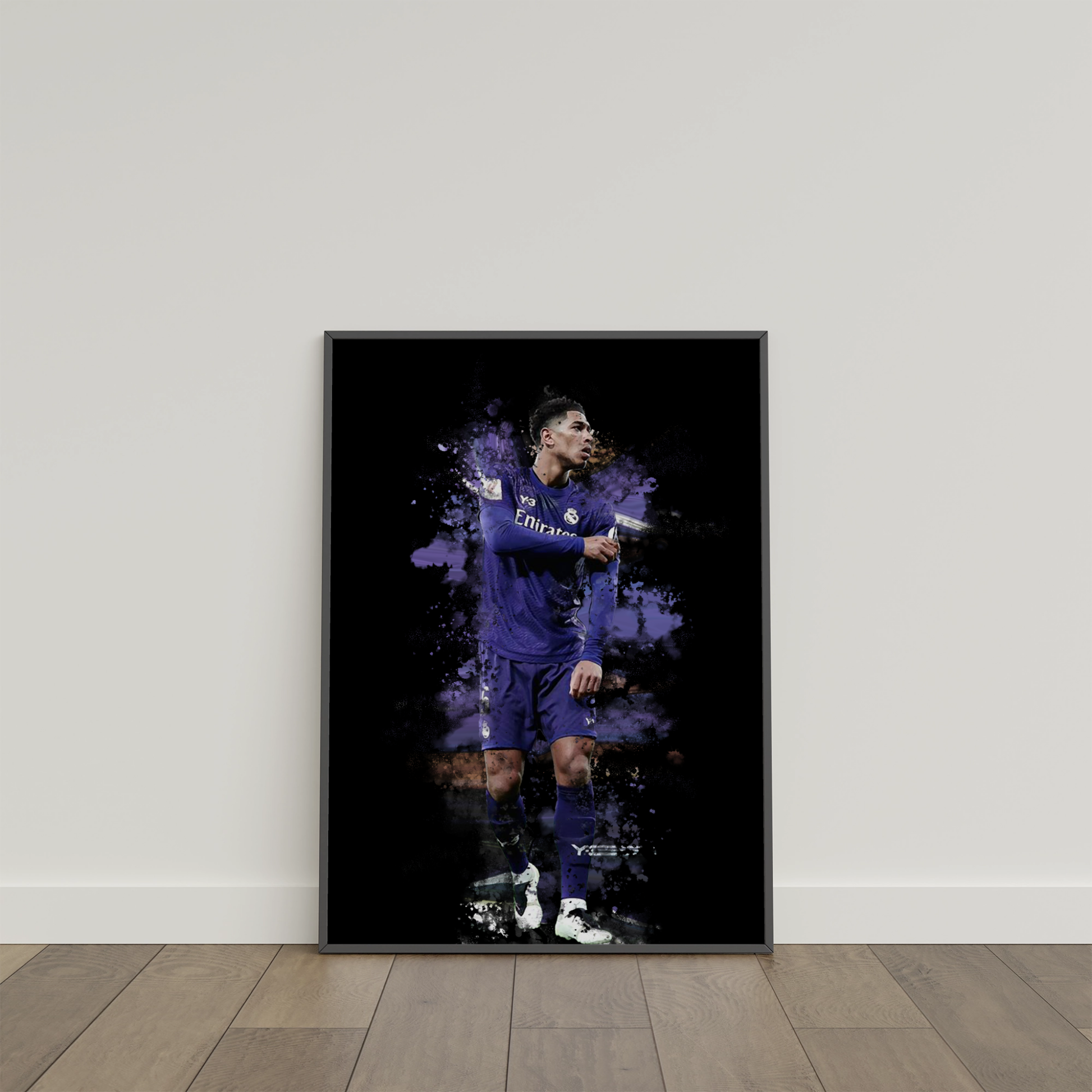 framed poster mockup of soccer player jude bellingham leaning on a white wall