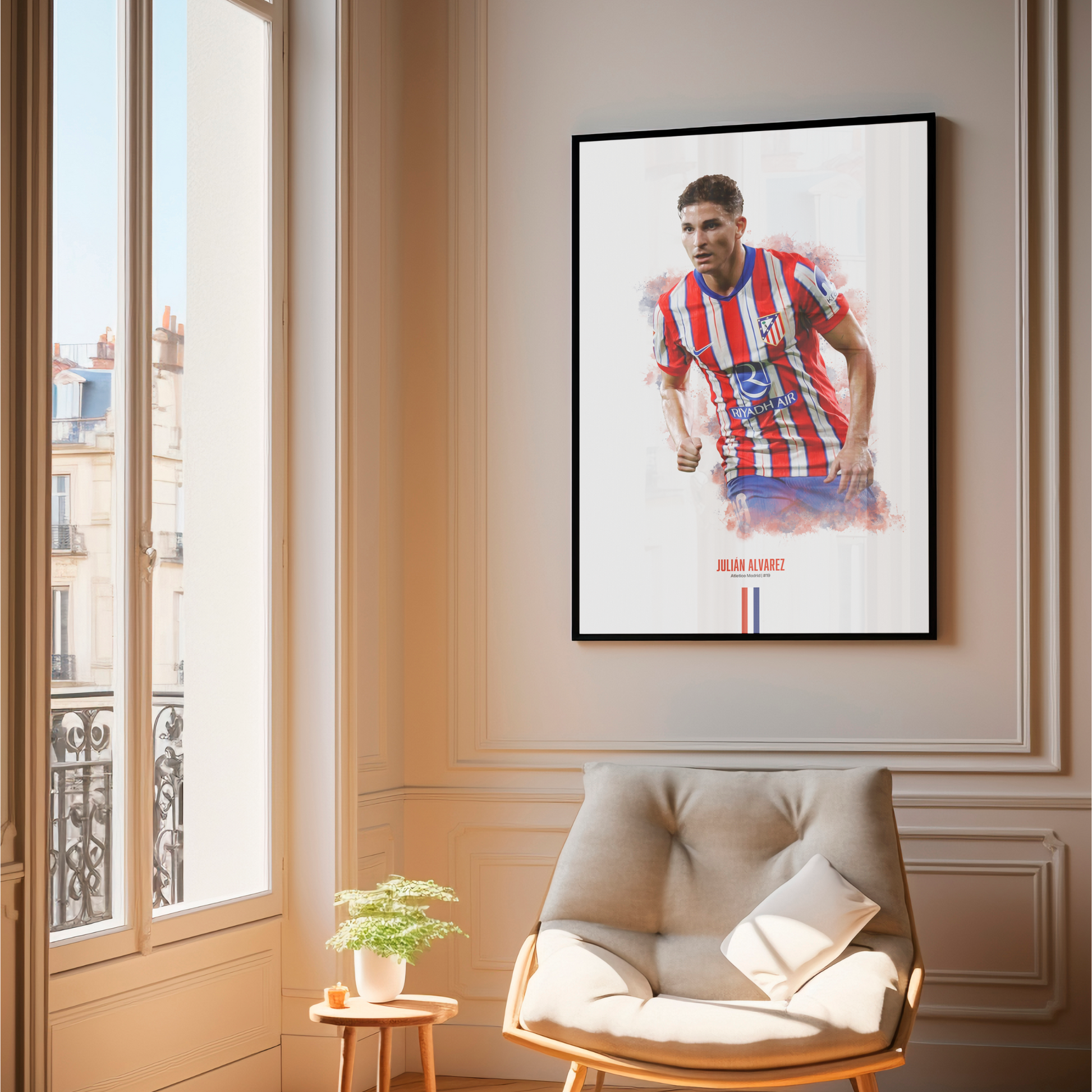 framed poster mockup of soccer player julian alvarez hanging in a living room