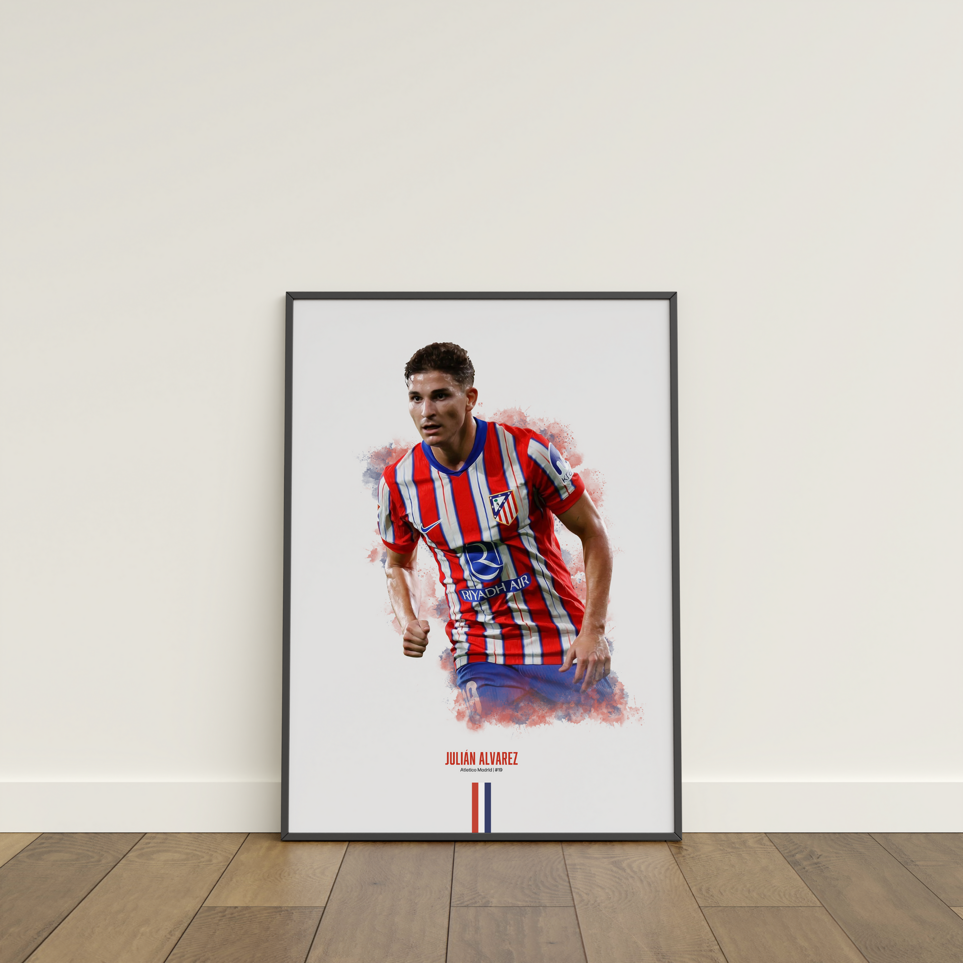 framed poster mockup of soccer player julian alvarez leaning on a white wall