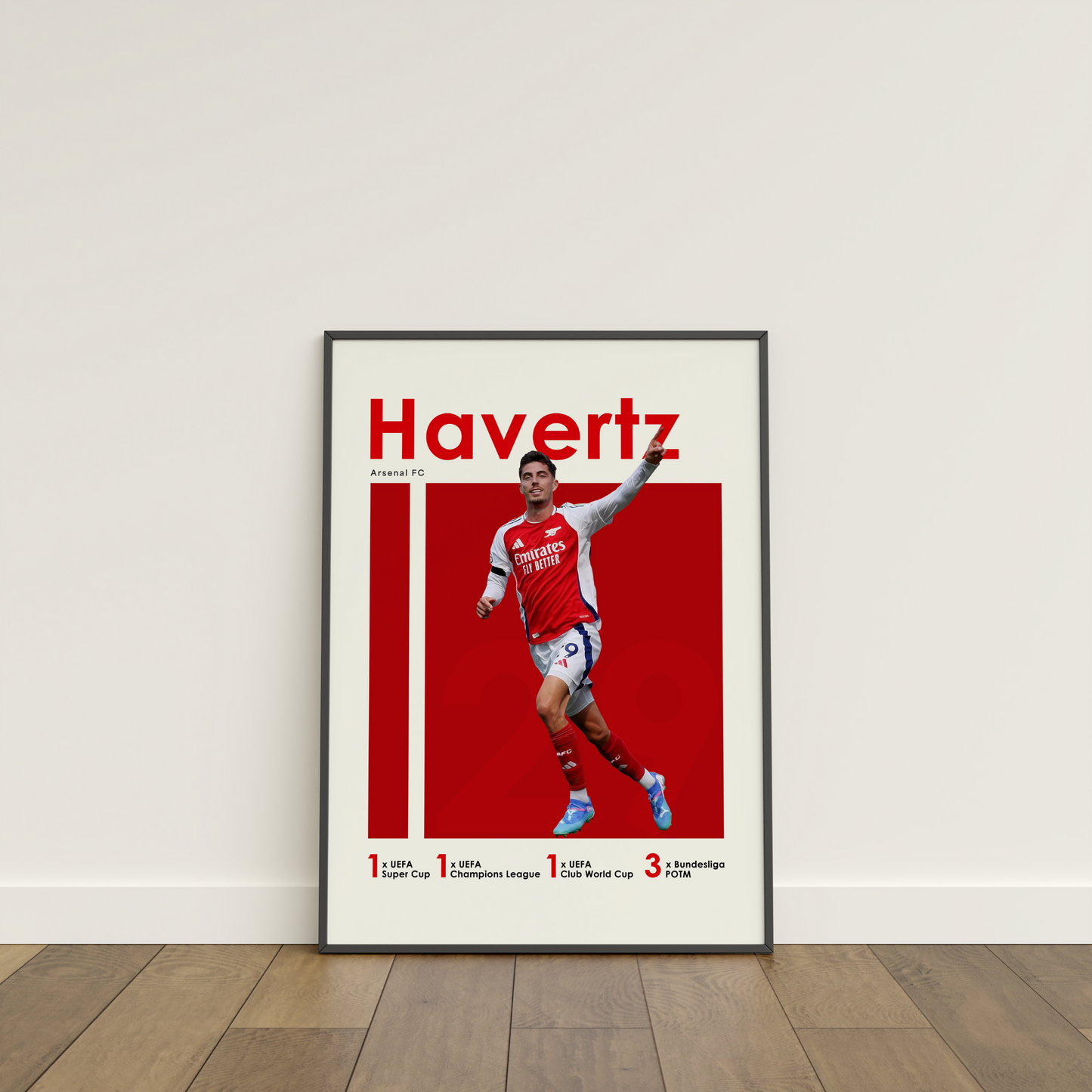 framed poster mockup of soccer player kai havertz leaning on a white wall