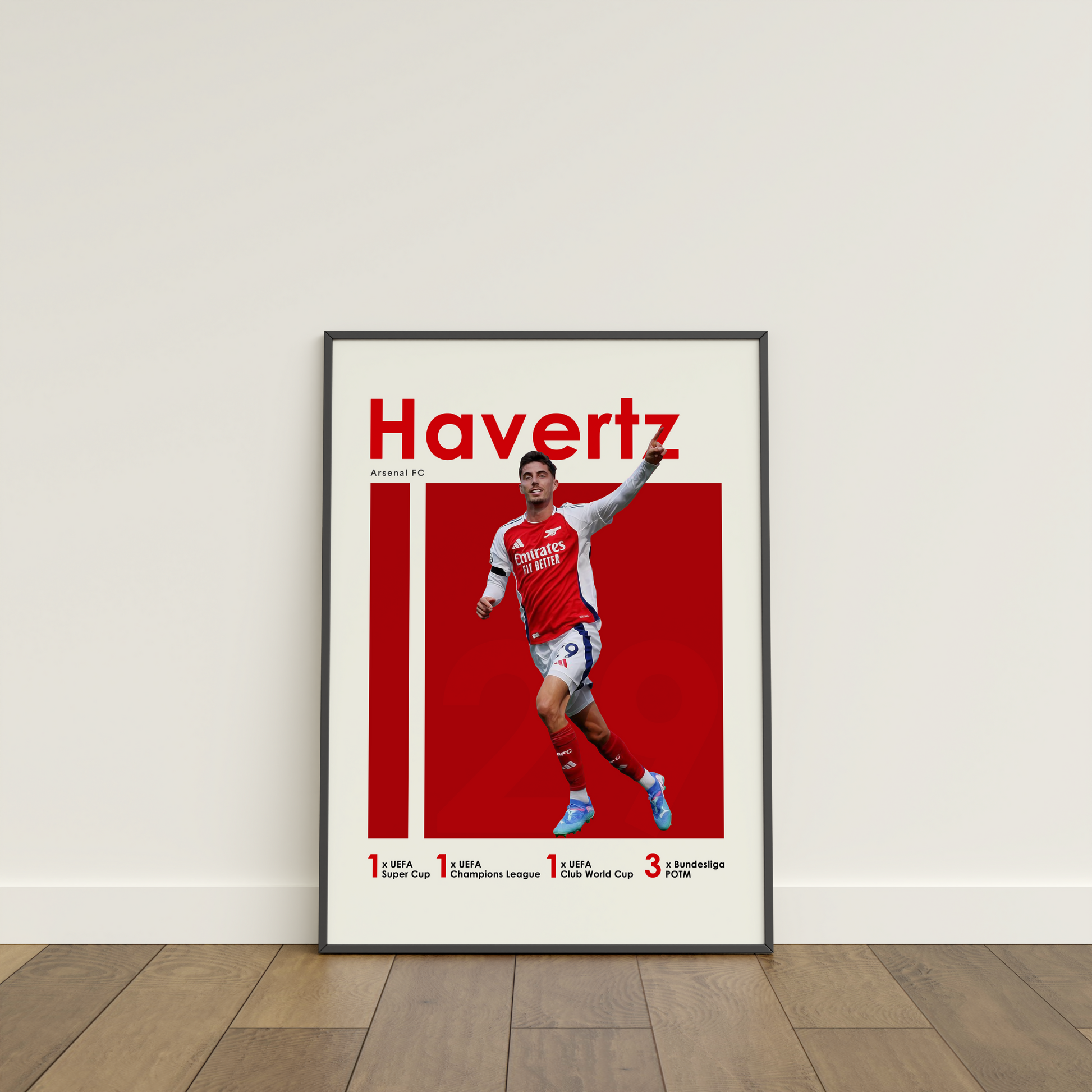 framed poster mockup of soccer player kai havertz leaning on a white wall