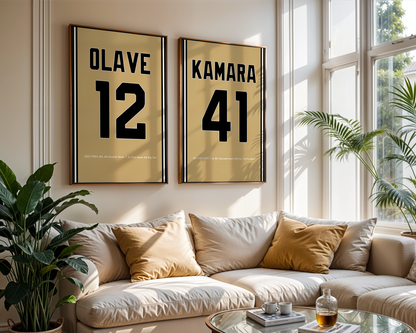 Living room with a beige sofa, decorative pillows, and framed numbers on the wall.