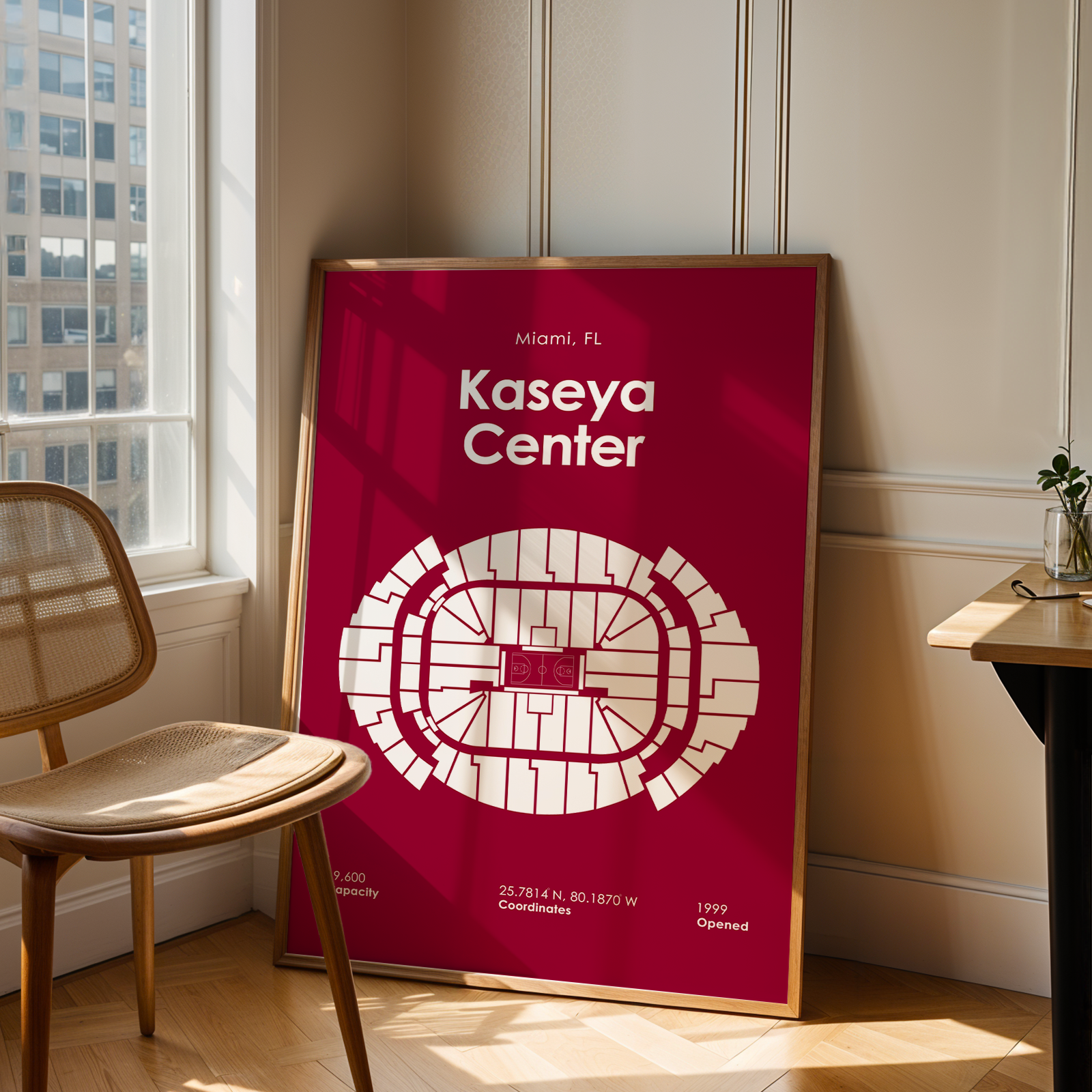 Red poster with 'Kaseya Center' design in a room with a chair and table.