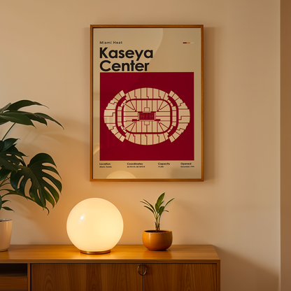 Framed poster of Kaseya Center on a wall above a wooden cabinet with decorative items.
