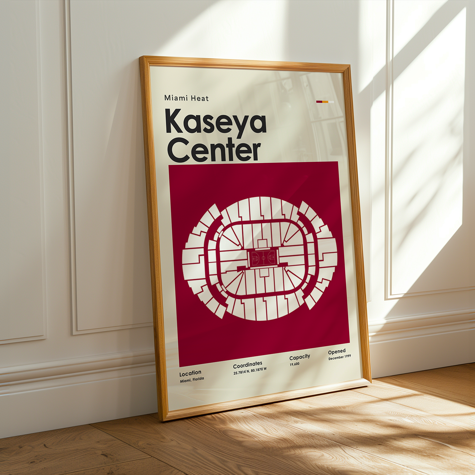 Framed poster of Kaseya Center with Miami Heat branding on a wall.