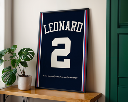 Framed sports jersey with 'LEONARD' and number '2' on a wooden shelf.