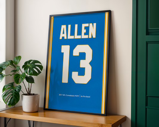 Framed sports jersey with 'Allen' and number '13' on a wooden shelf.