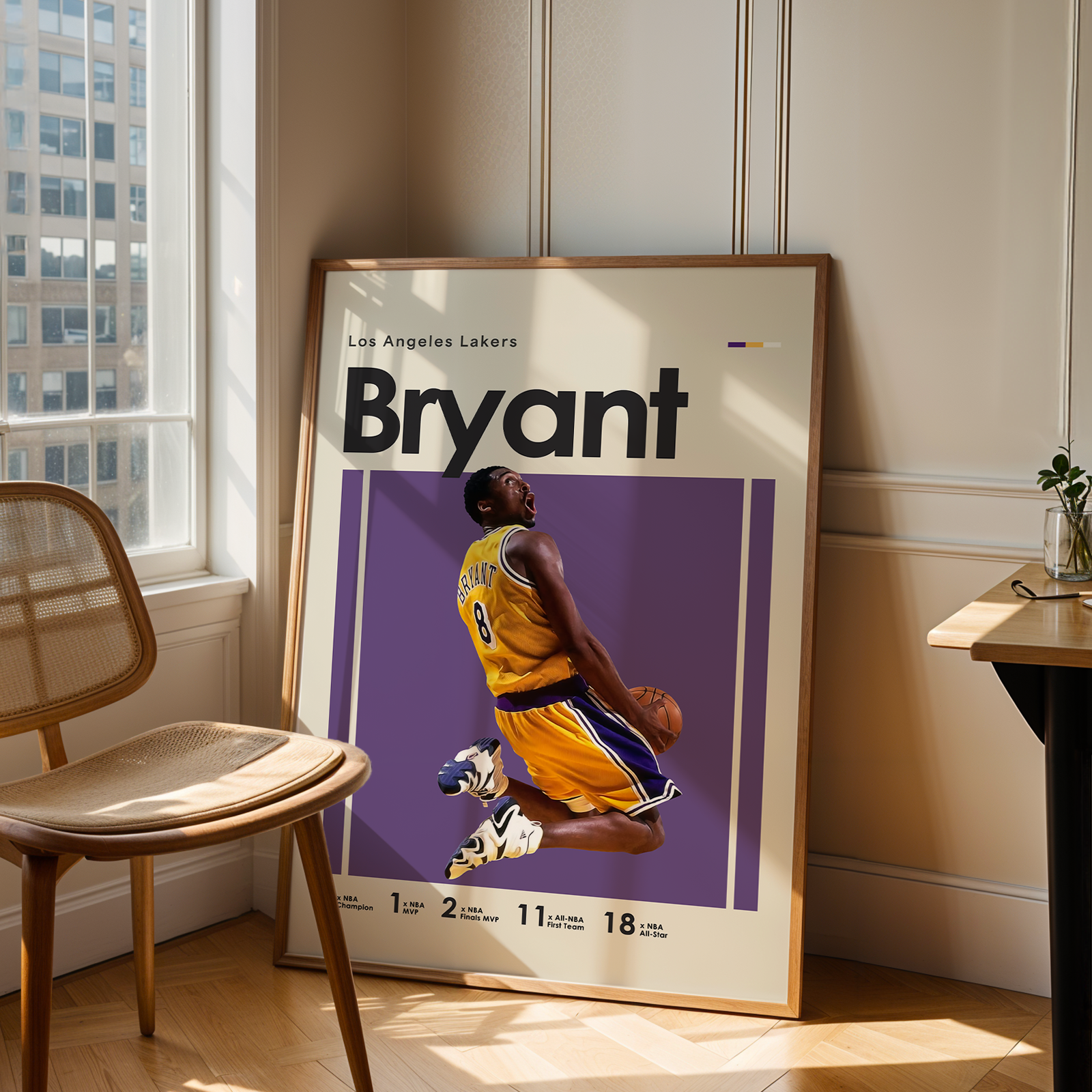 Framed poster of a basketball player in a room with a chair and table.