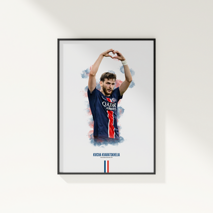 Framed poster print of soccer player Kvicha Kvaratskhelia, wearing a PSG jersey, on a white wall.