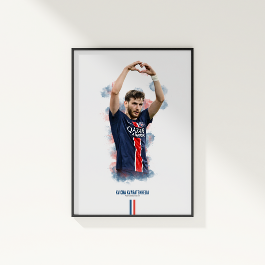 Framed poster print of soccer player Kvicha Kvaratskhelia, wearing a PSG jersey, on a white wall.