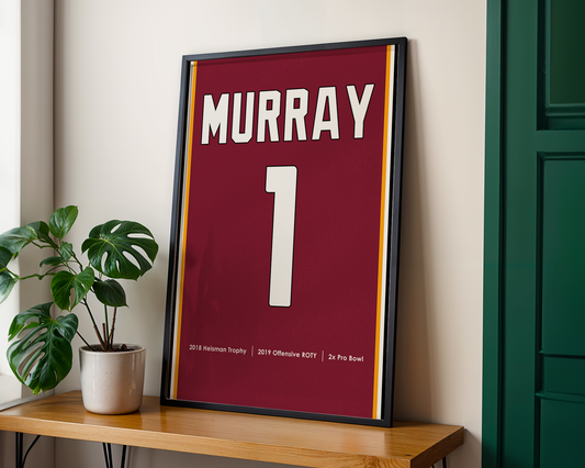 Framed sports jersey with 'Murray' and number '1' on a wooden shelf.