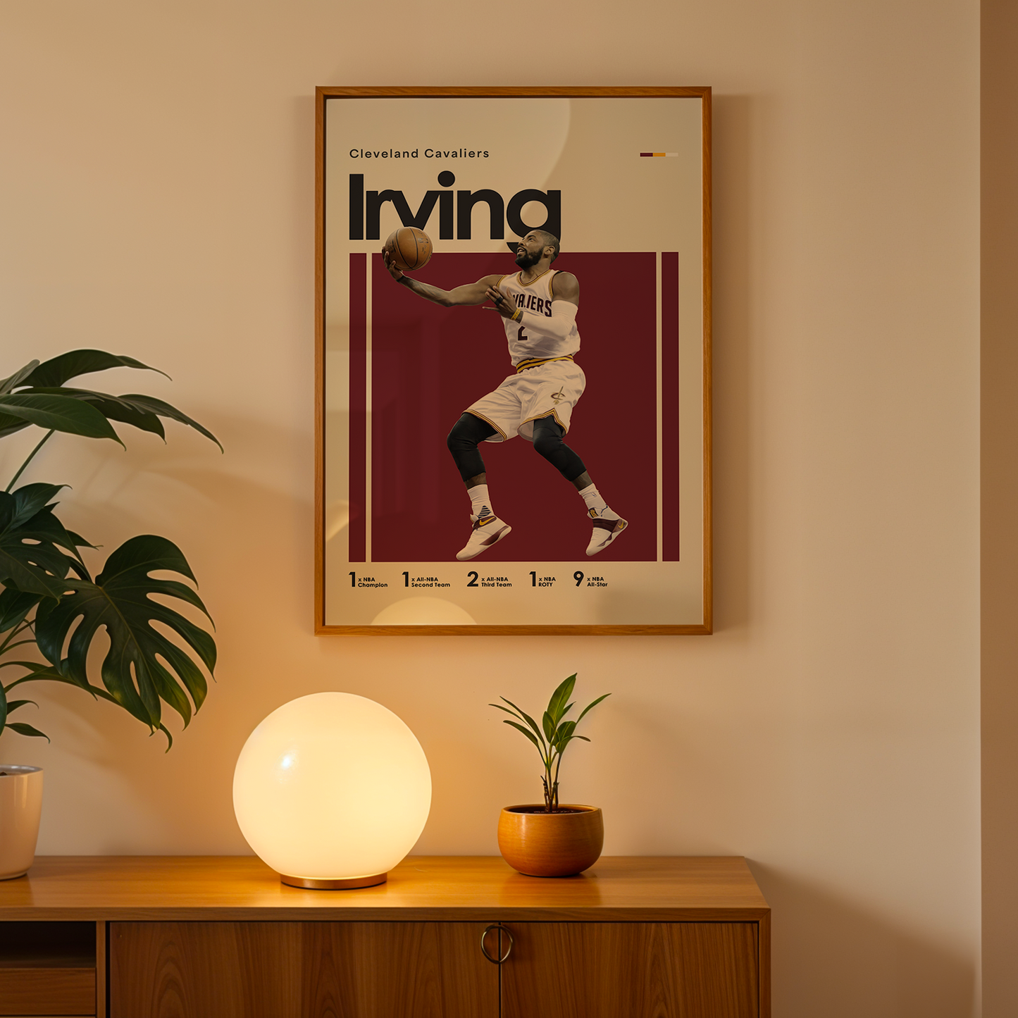 Framed poster of a basketball player on a wall above a wooden cabinet with decorative items.