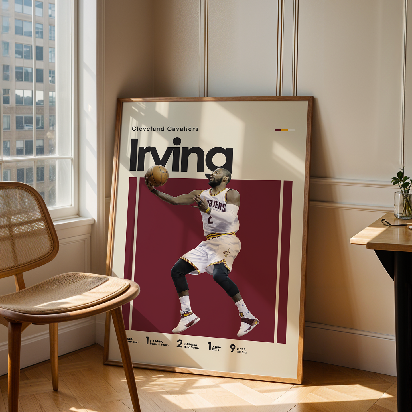 Framed poster of a basketball player in a room with a chair and table.