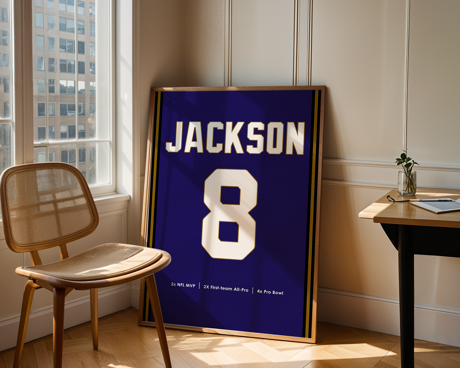 Framed sports jersey with 'Jackson' and number '8' in a room with a window and chair.
