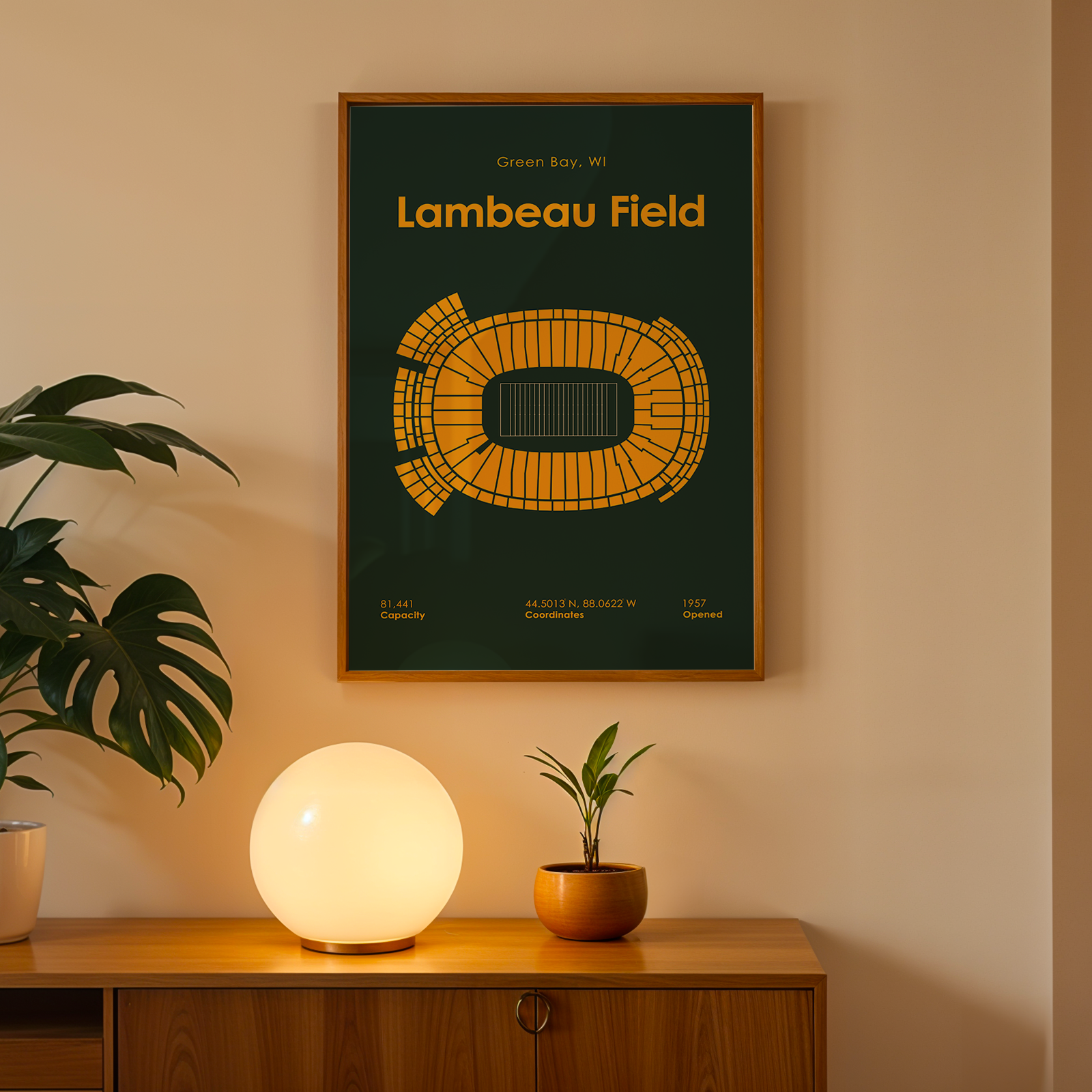 Poster of Lambeau Field on a wall above a wooden cabinet with decorative items.