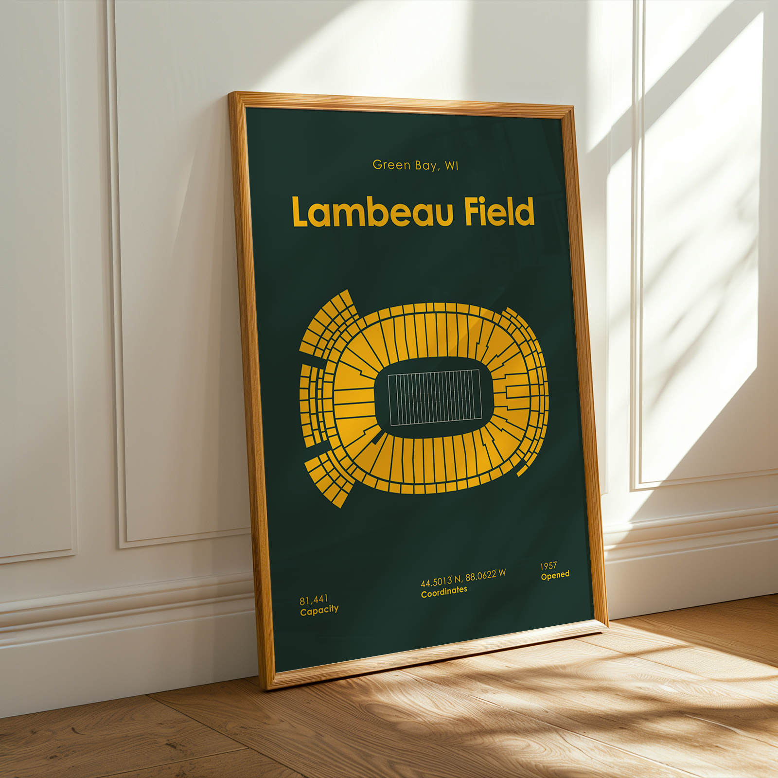 Framed poster of Lambeau Field in Green Bay, WI on a wall.