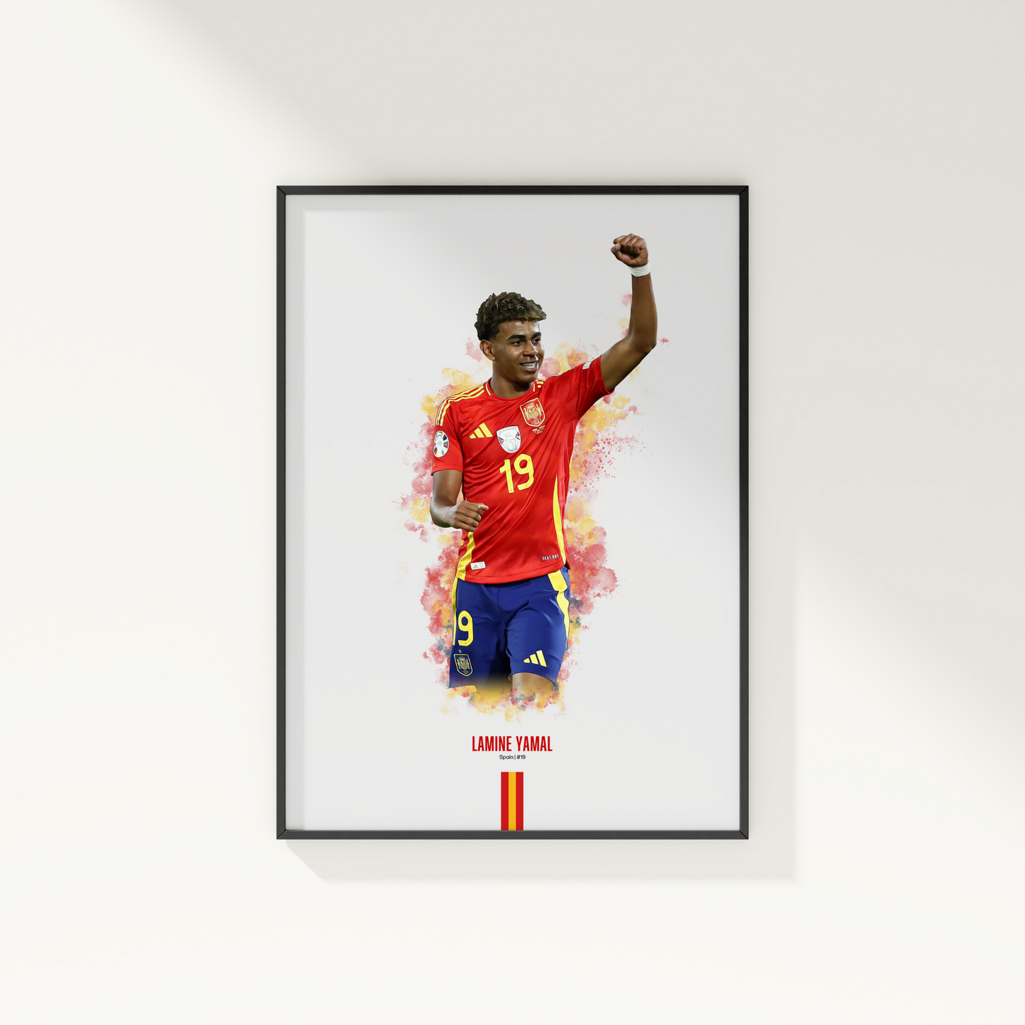 framed poster mockup of soccer player lamine yamal hanging on a white wall