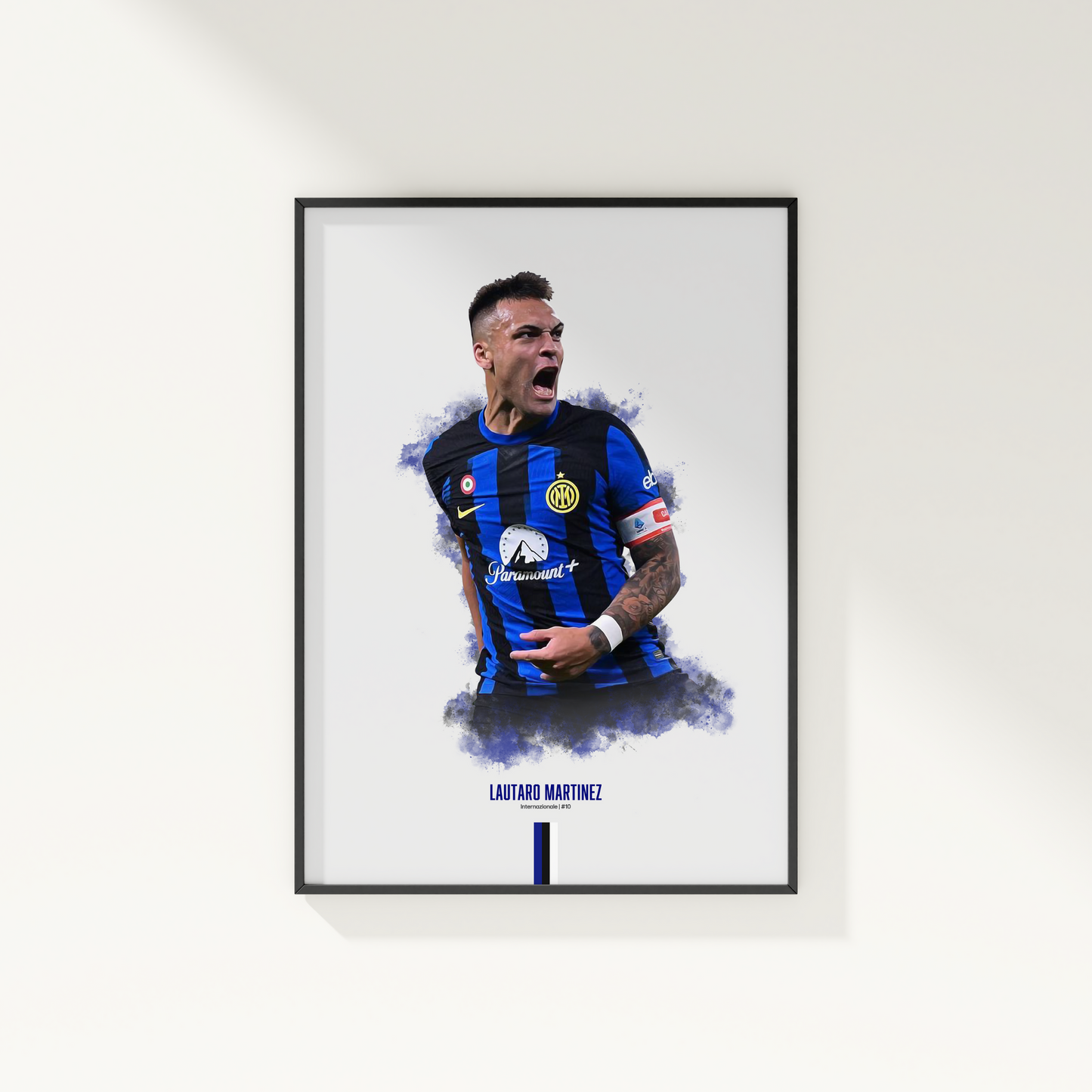 framed poster mockup of soccer player lautaro martinez hanging on a white wall