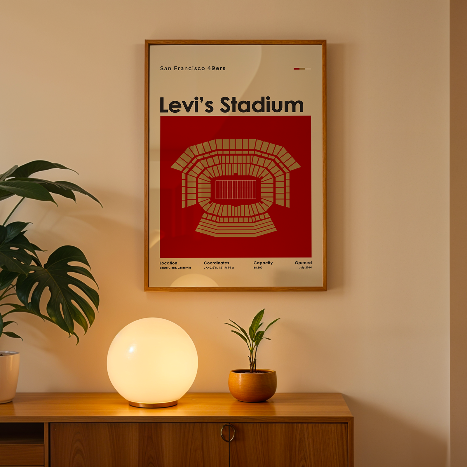 Levi's Stadium poster on a wall above a wooden cabinet with decorative items.