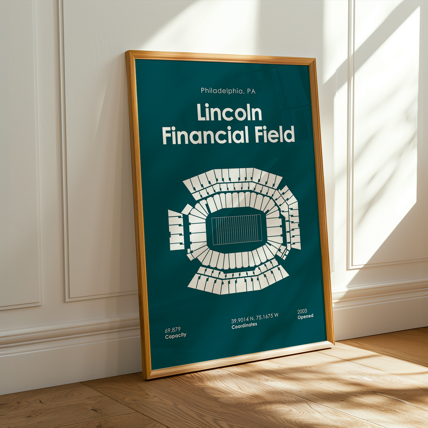 Framed poster of Lincoln Financial Field in a room with sunlight streaming through a window.