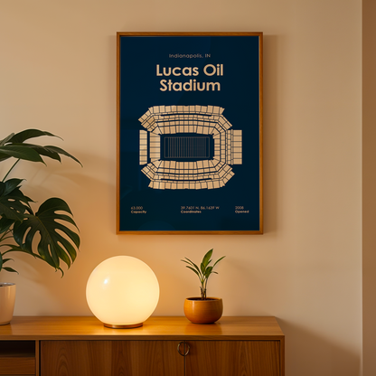 Framed poster of Lucas Oil Stadium on a wall above a wooden cabinet with decorative items.