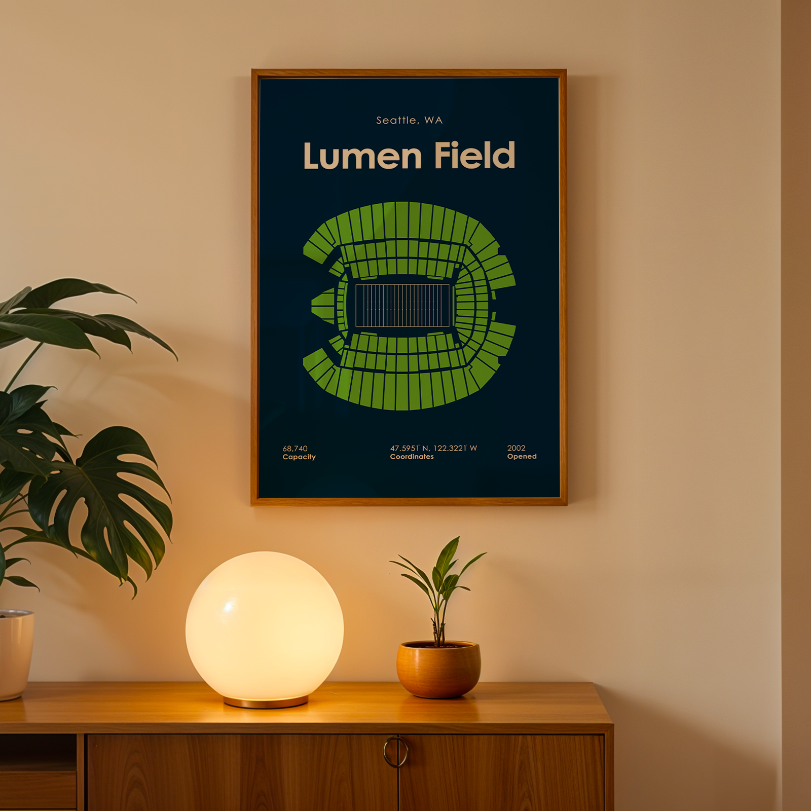 Framed 'Lumen Field' poster on a wall above a wooden cabinet with decorative items.