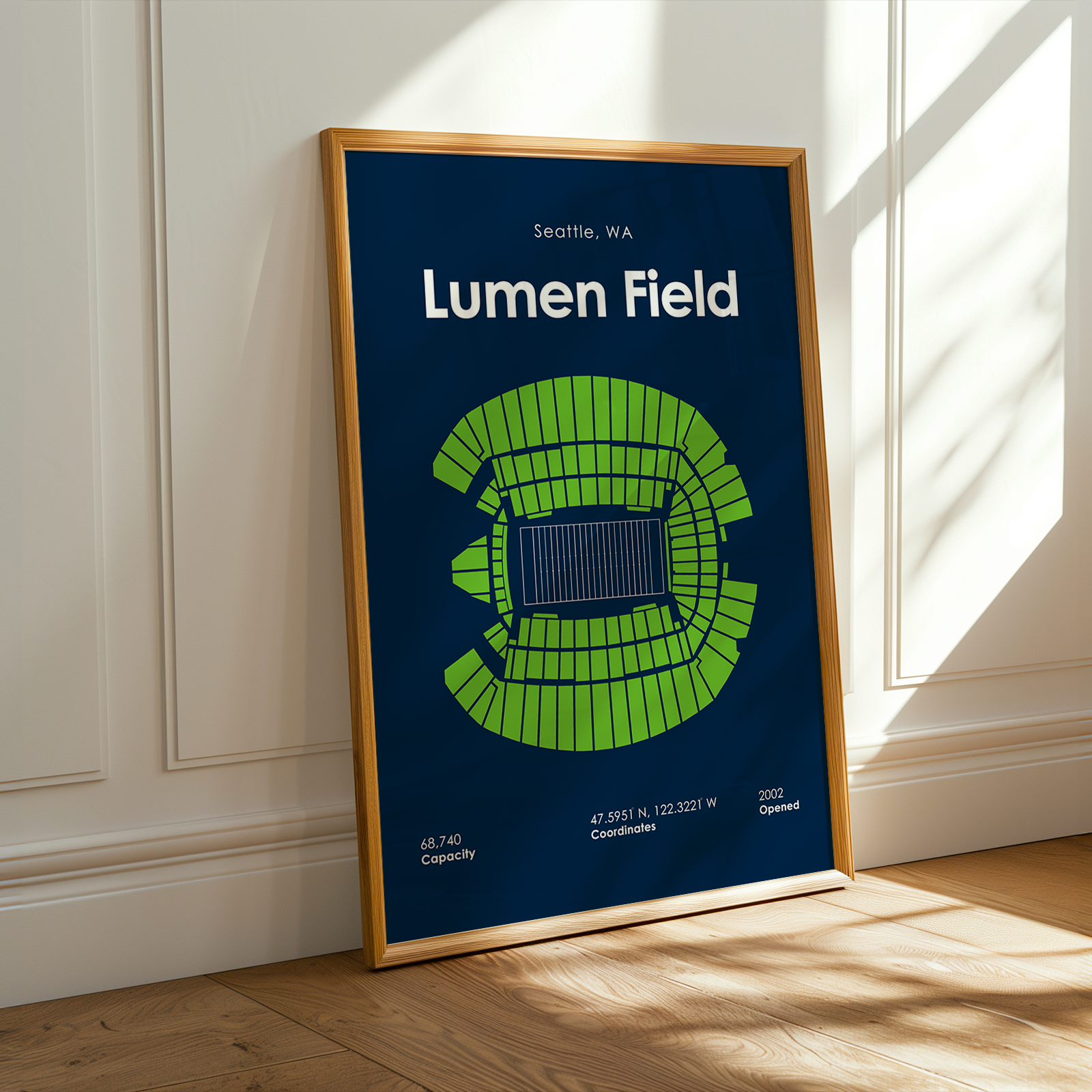 Framed poster of Lumen Field with seating chart on a wall.