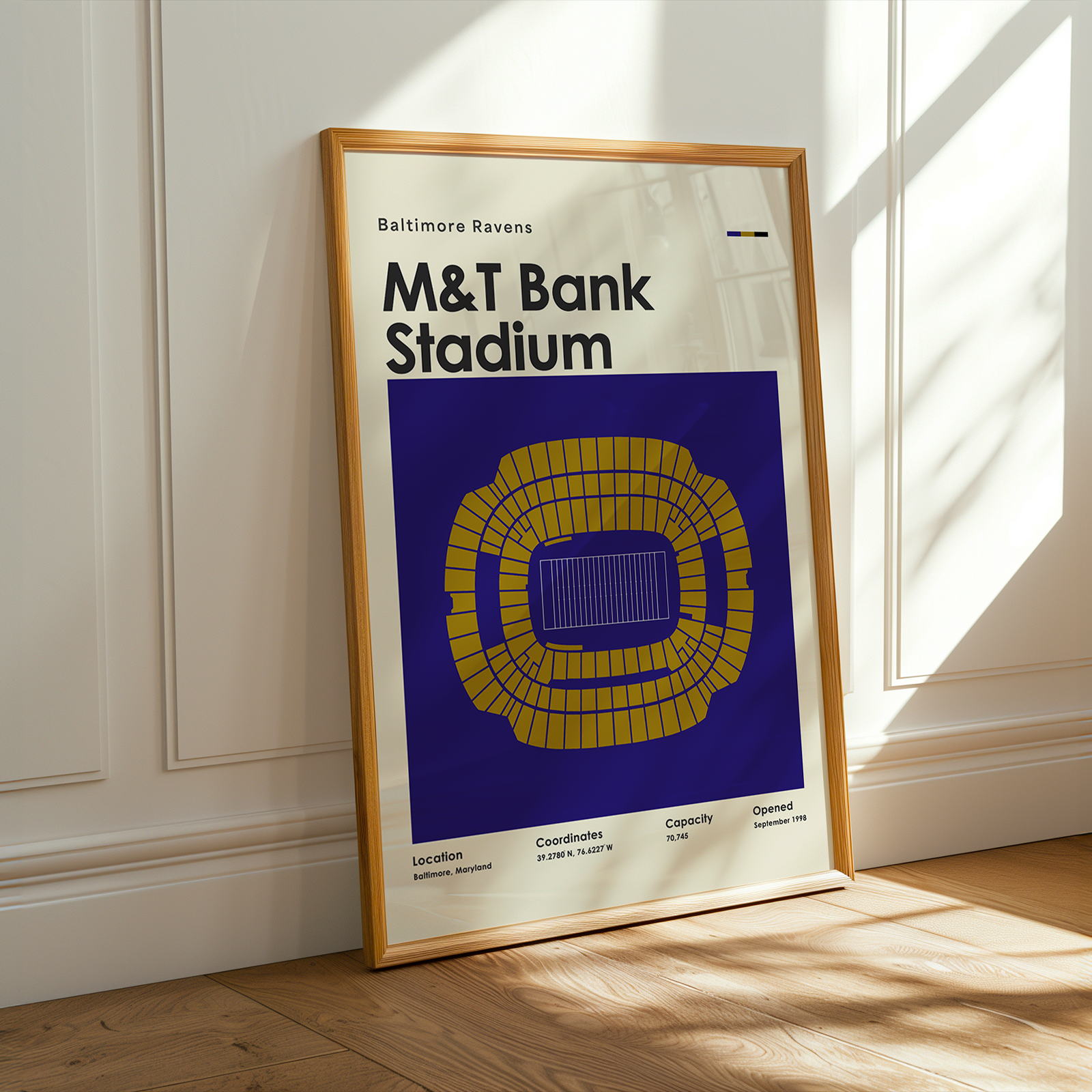 Framed poster of M&T Bank Stadium with Baltimore Ravens branding on a wall.